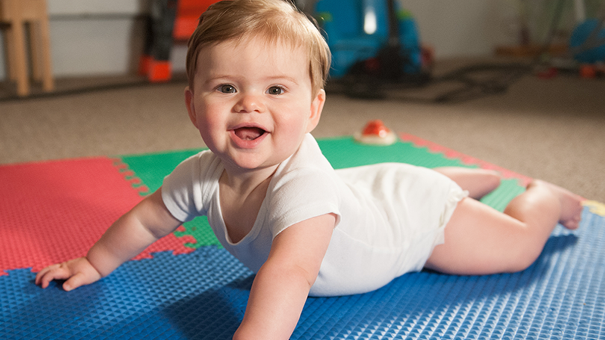 6-month baby lying on ground