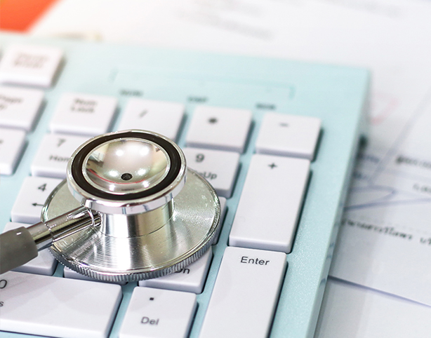 hcp-resources closeup of a stethoscope on a computer keyboard