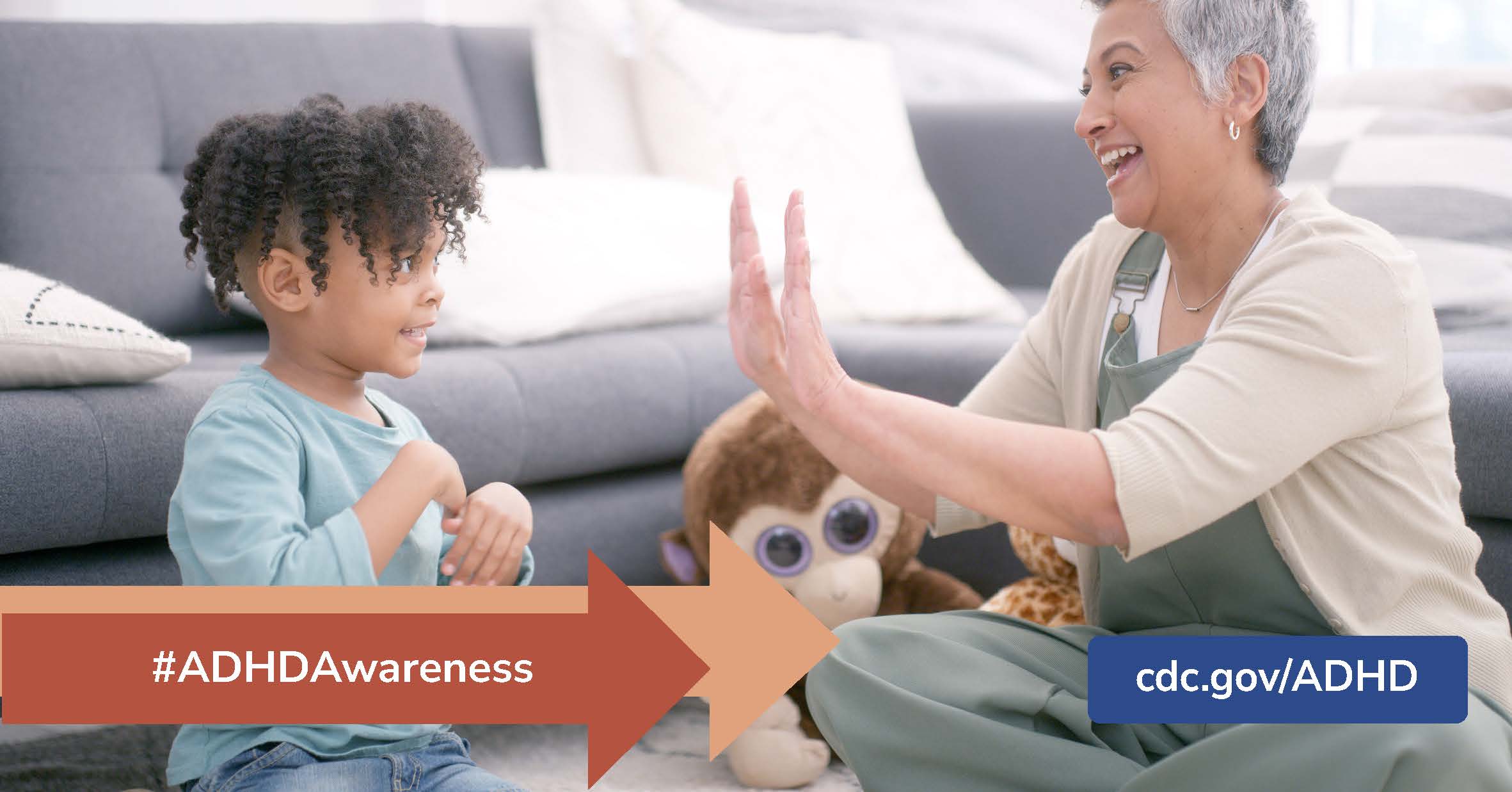 Grandson smiling and laughing during play time with grandmother with banner of #ADHDAwareness