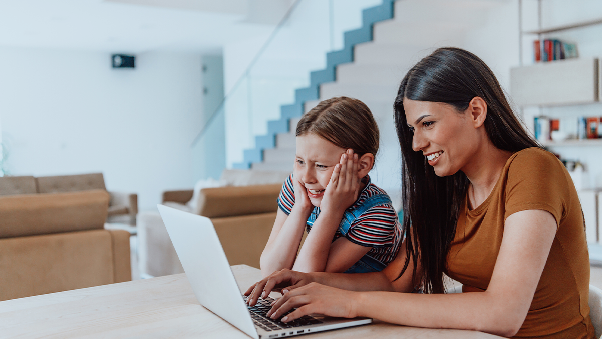 A mother and daughter searching the internet for a therapist.