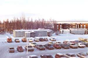 Aerial view of AIP's former building, along with a view of the parking lot.