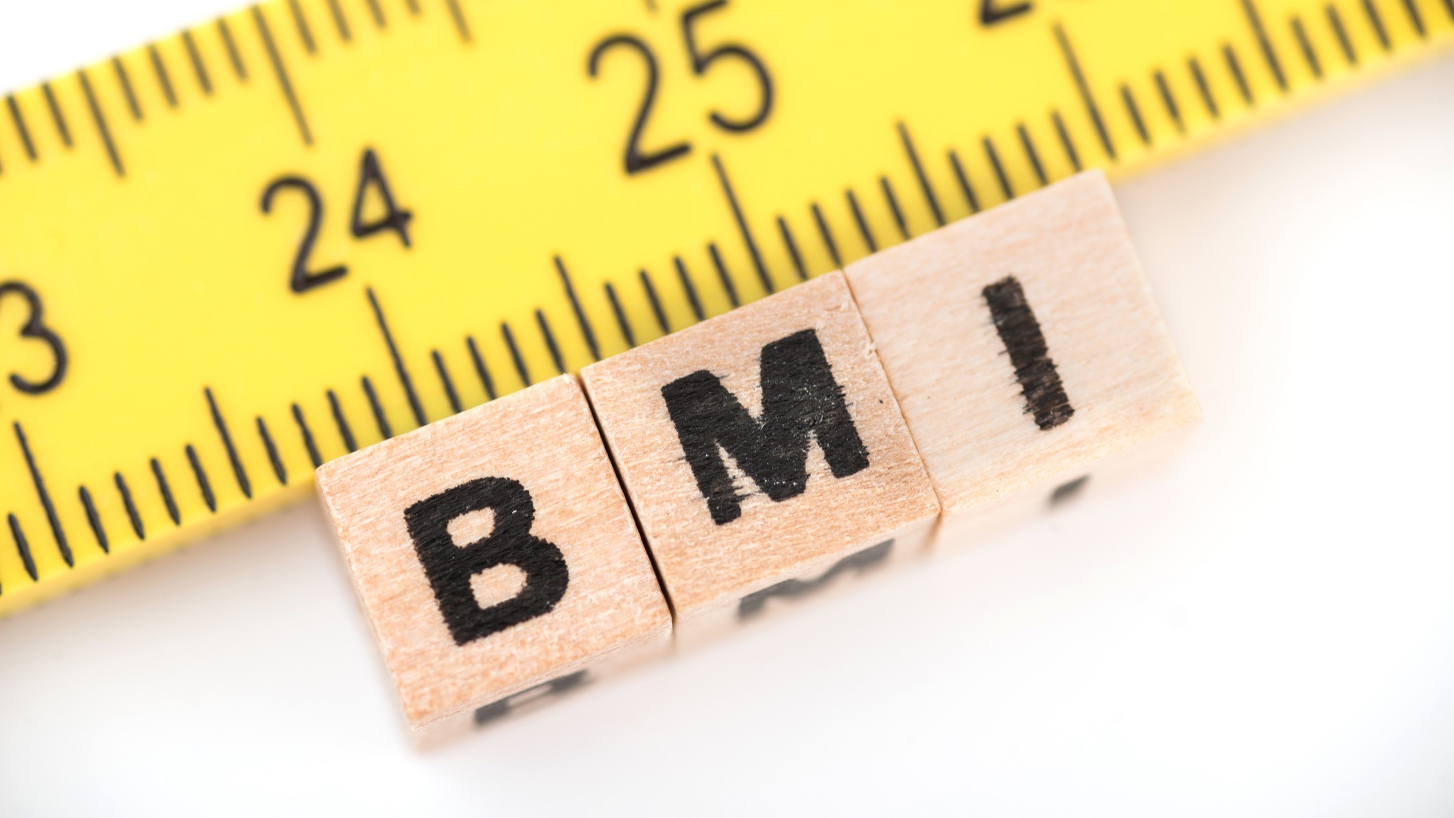 bmi Block letters spelling BMI and a tape measure