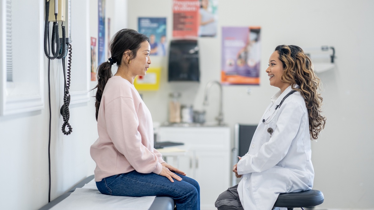 A woman patient talks to her woman doctor
