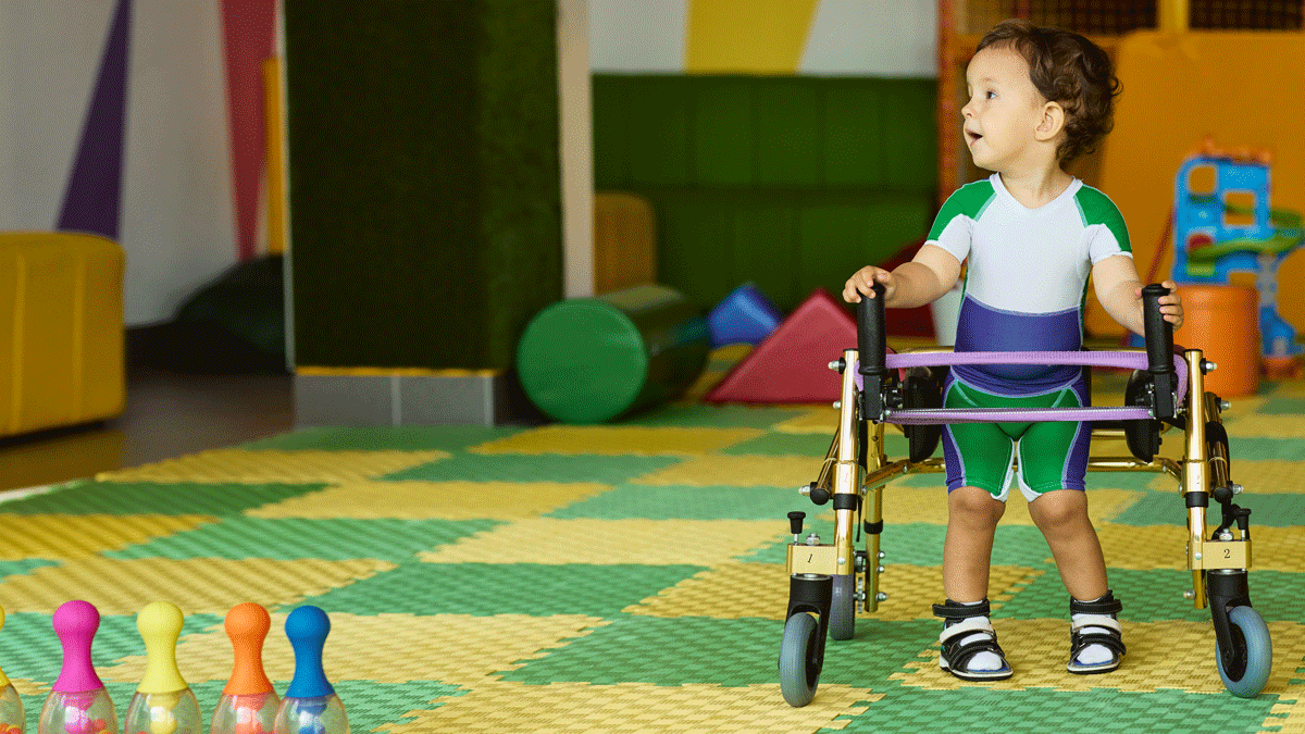 Special needs child using a walker