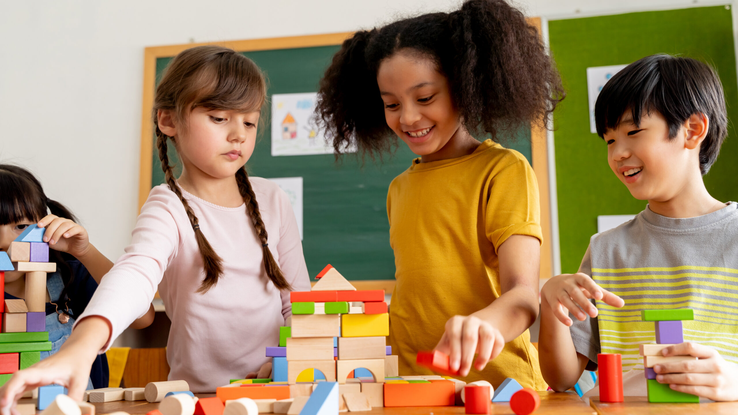 Children playing with blocks in a classroom
