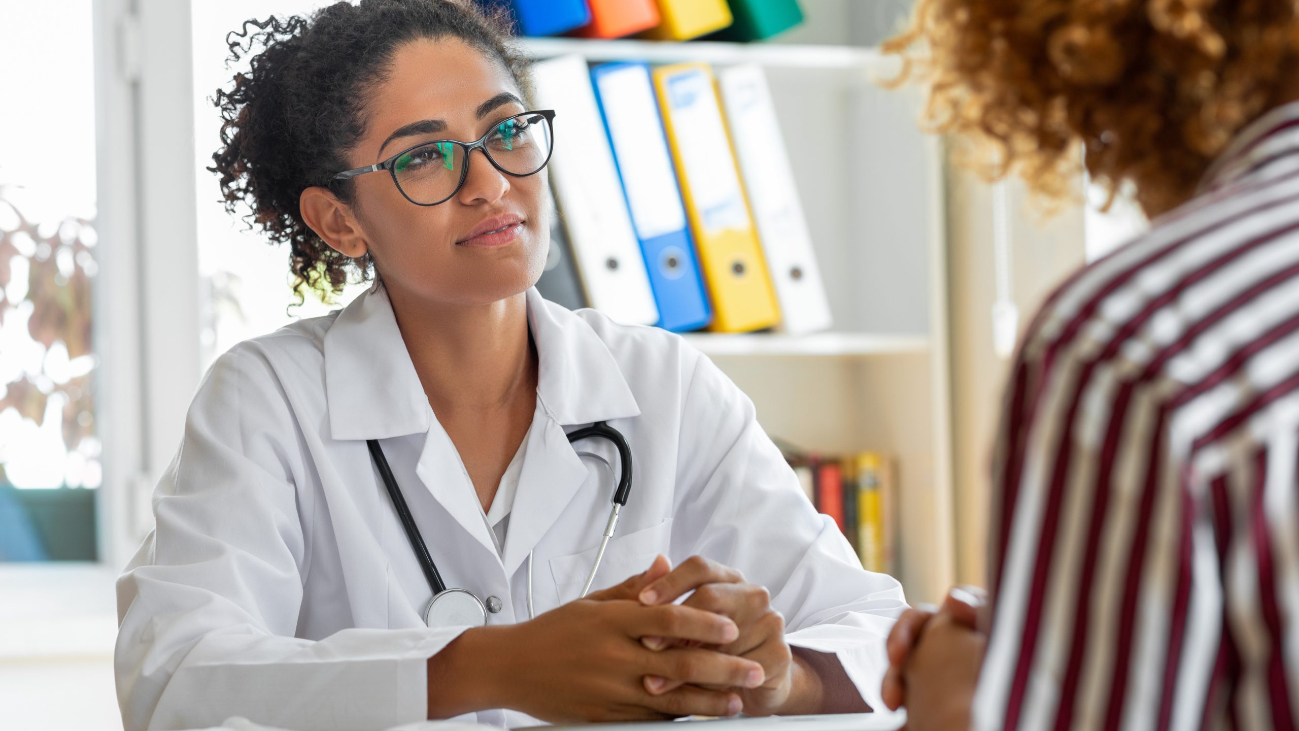 Healthcare provider listening to a patient.