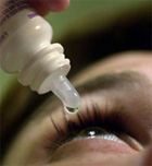 eyedrops.jpg Person putting eyedrops in eye.
