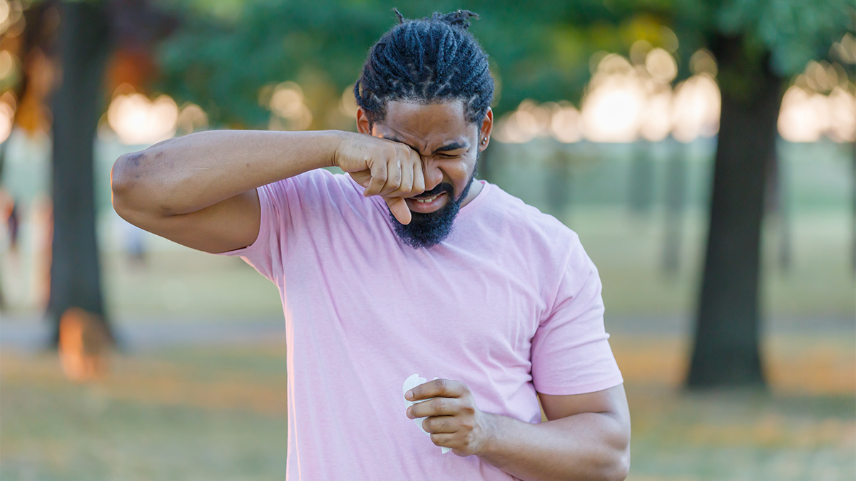 Man rubbing his eye