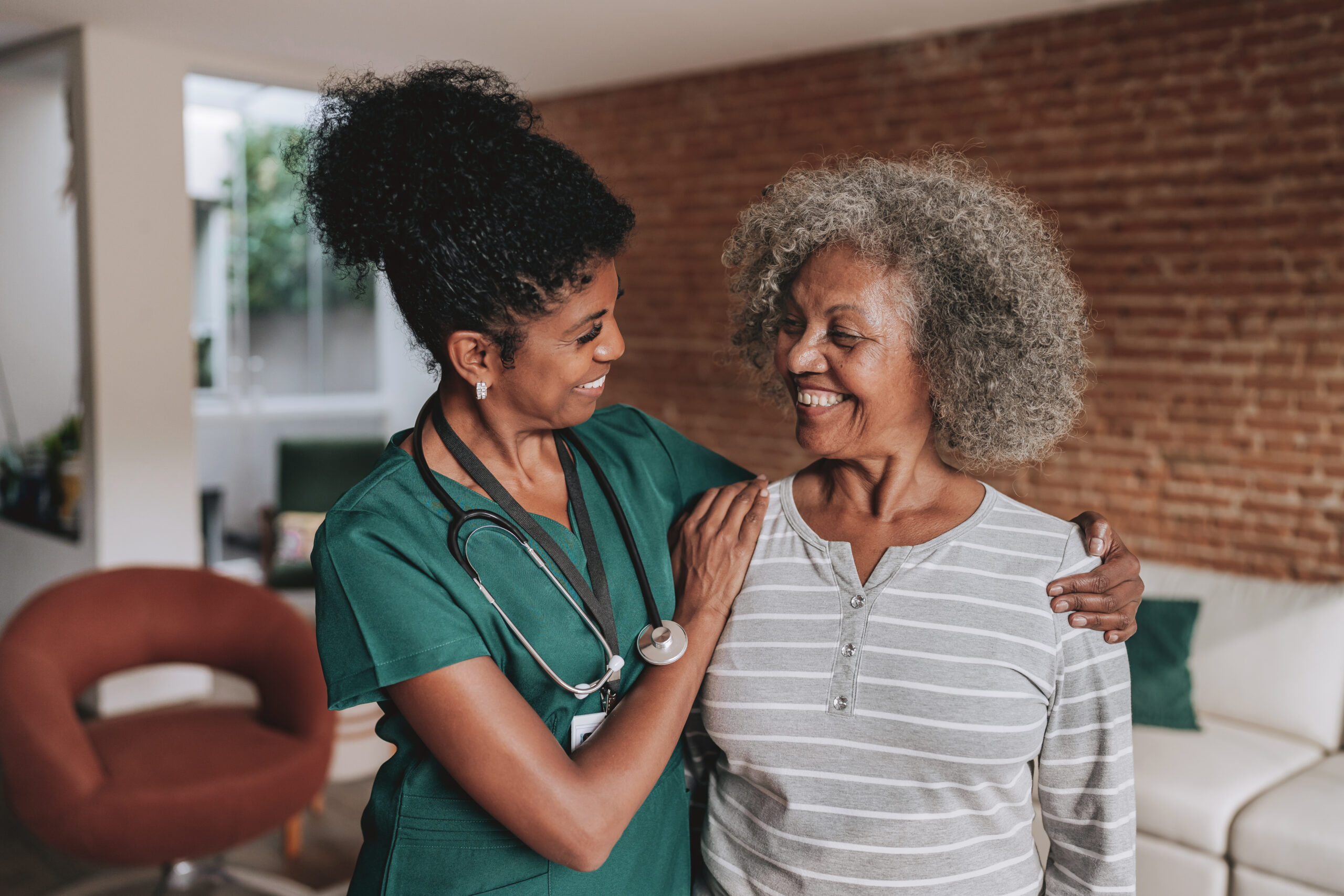 Healthcare worker smiling at patient