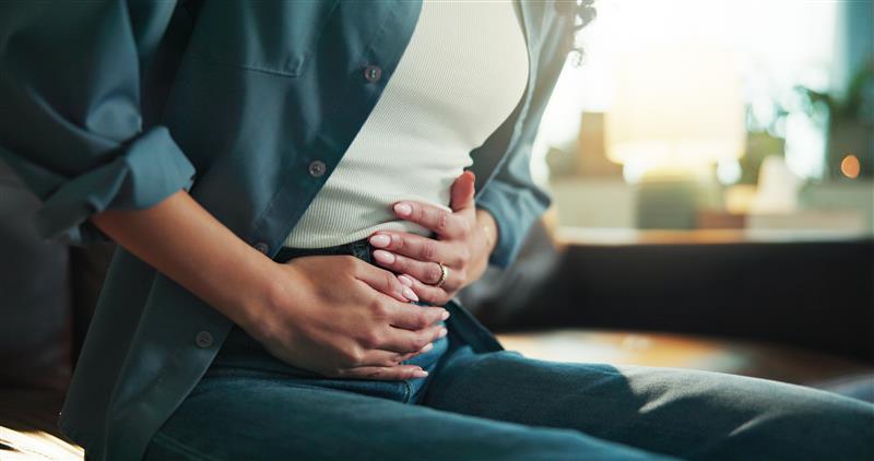 Woman holding her stomach