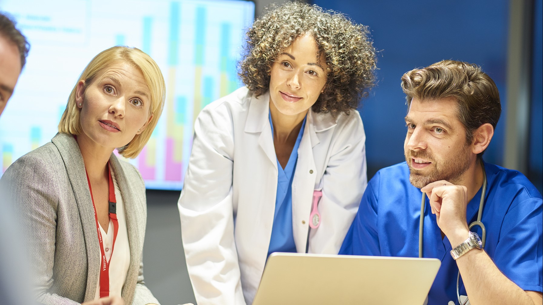 — title missing — Group of health care partners having a discussion around a table