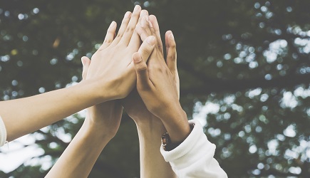 Team work and together concept, Hand of people high five for tag team Four hands raised in the air