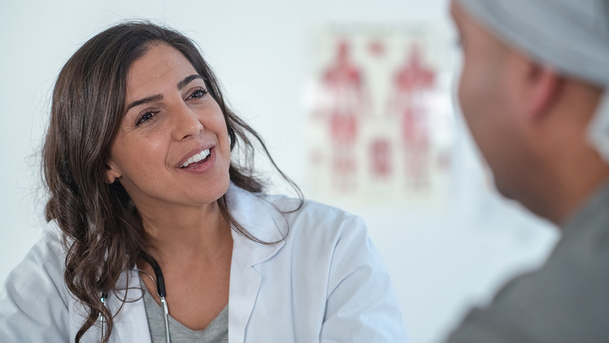 Health care professional talking to patient