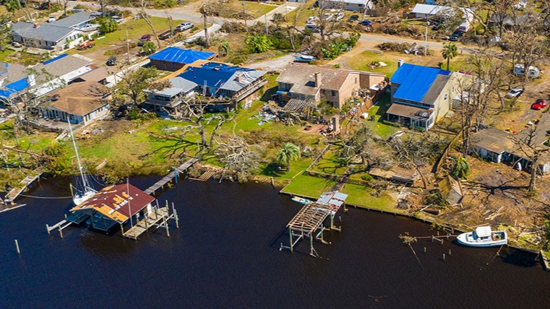 Public health surveillance Aerial view of a neighborhood damaged by a natural disaster.