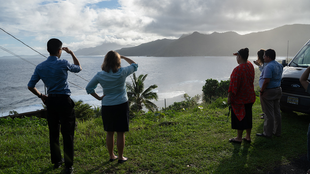 Howard Chiou with team in American Samoa overlooking ocean.