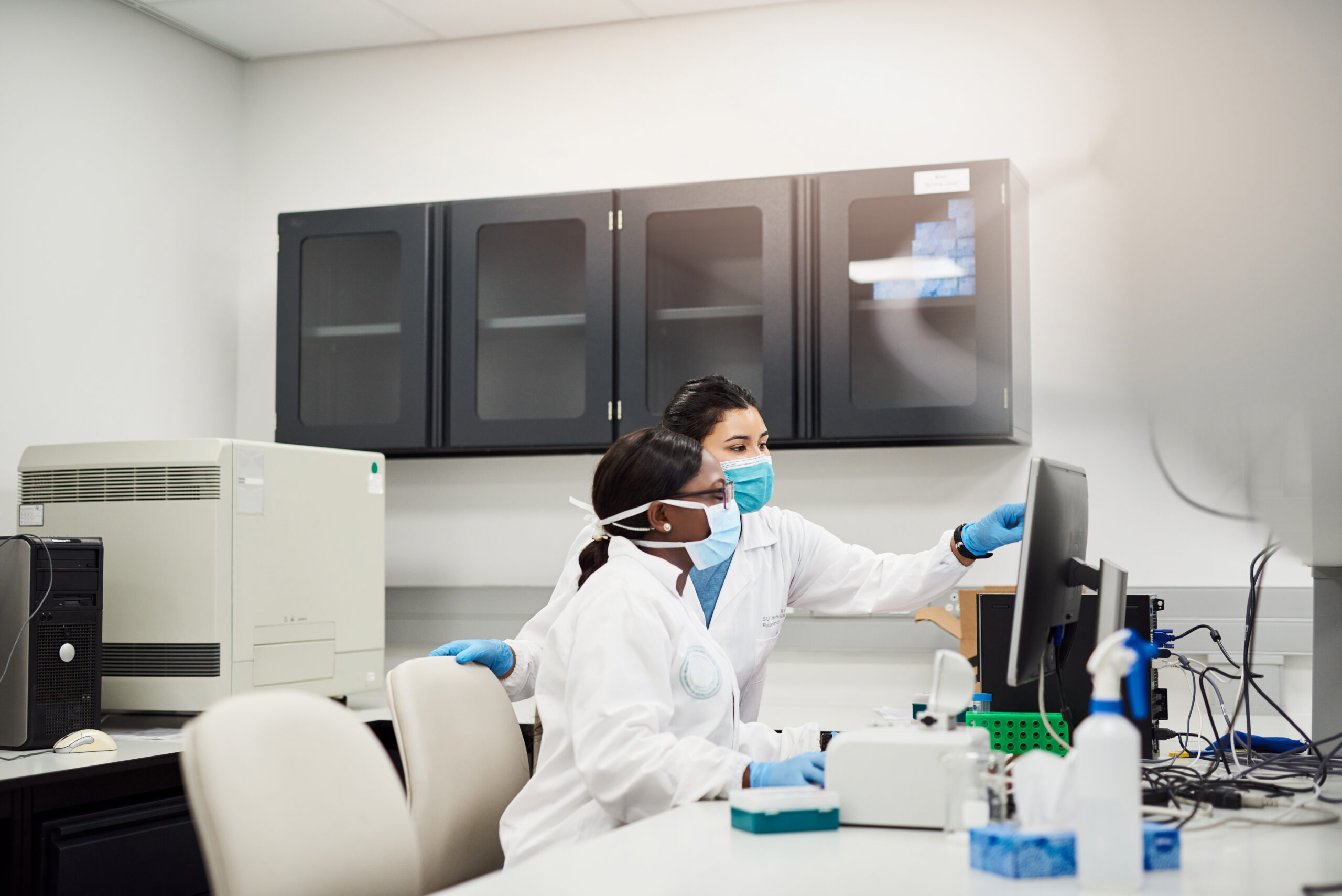 Shot of two young scientists conducting research in a laboratory