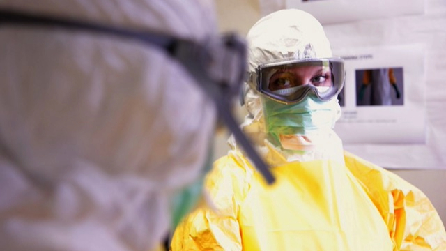 Woman wearing yellow personal protective equipment