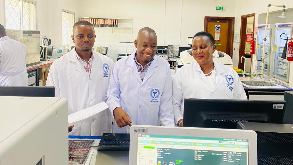 Graduates working in a laboratory testing samples