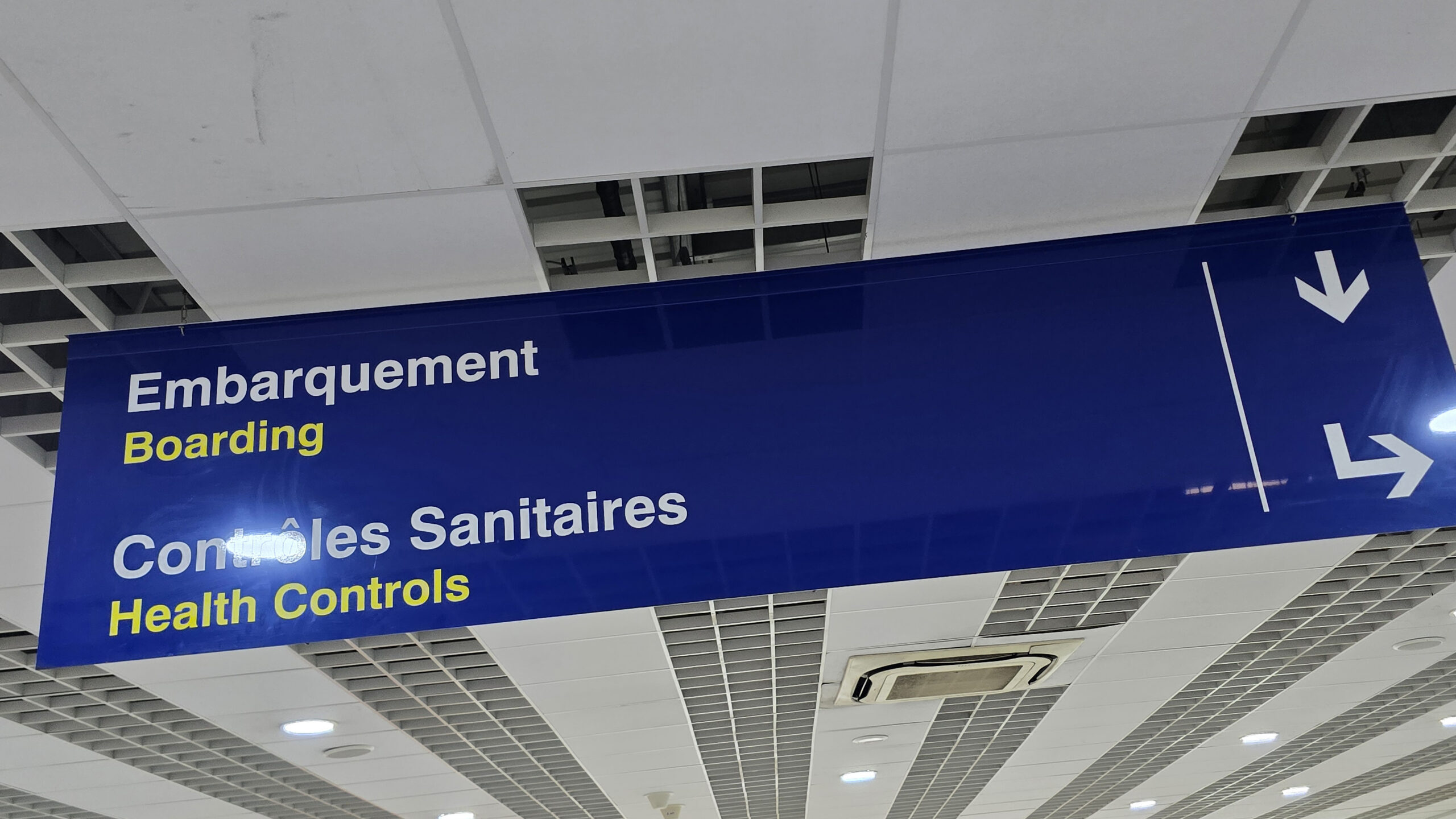 Sign in Kinshasa-N'djili International Airport directing travelers to Ebola health screening. Kinshasa, DRC