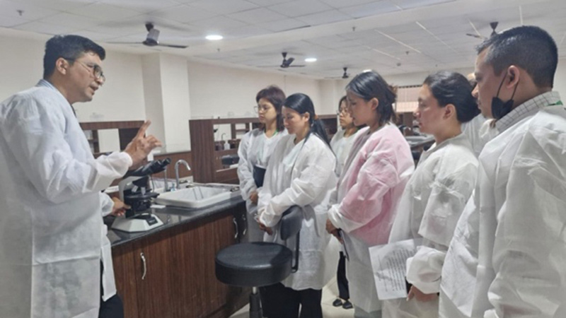 India Teacher in classroom with students teaching at Microbiology Training Foundation