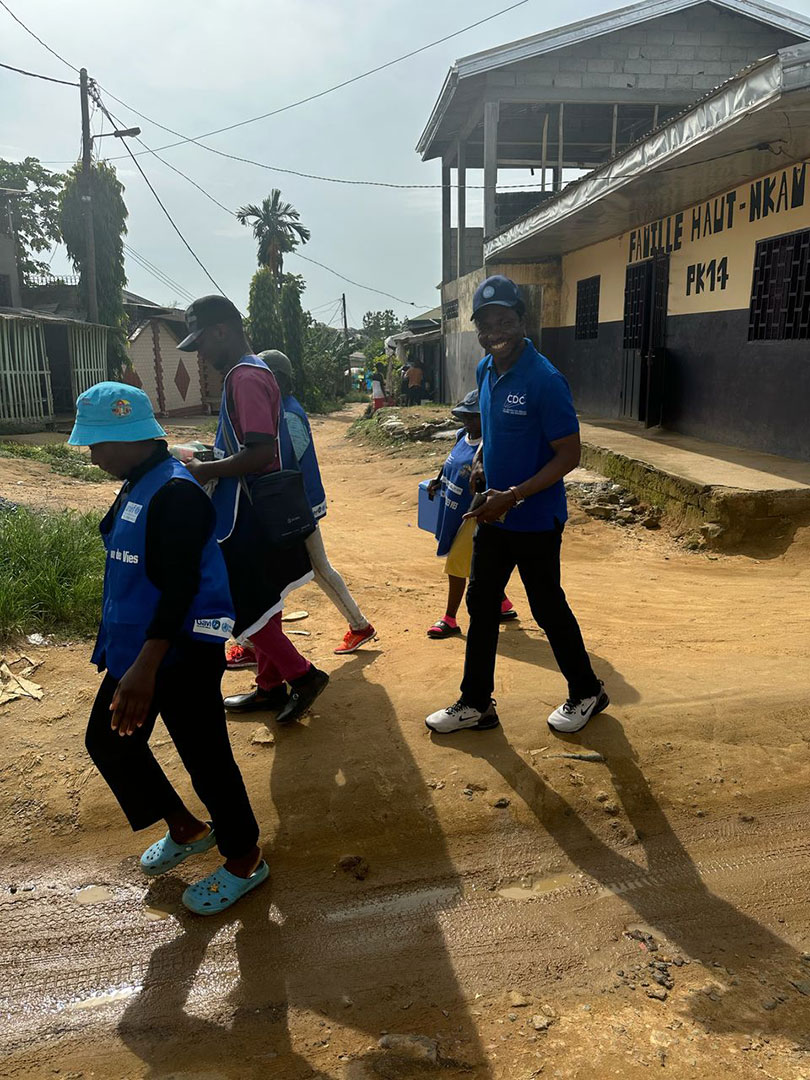 A group of health professionals walking on a street.