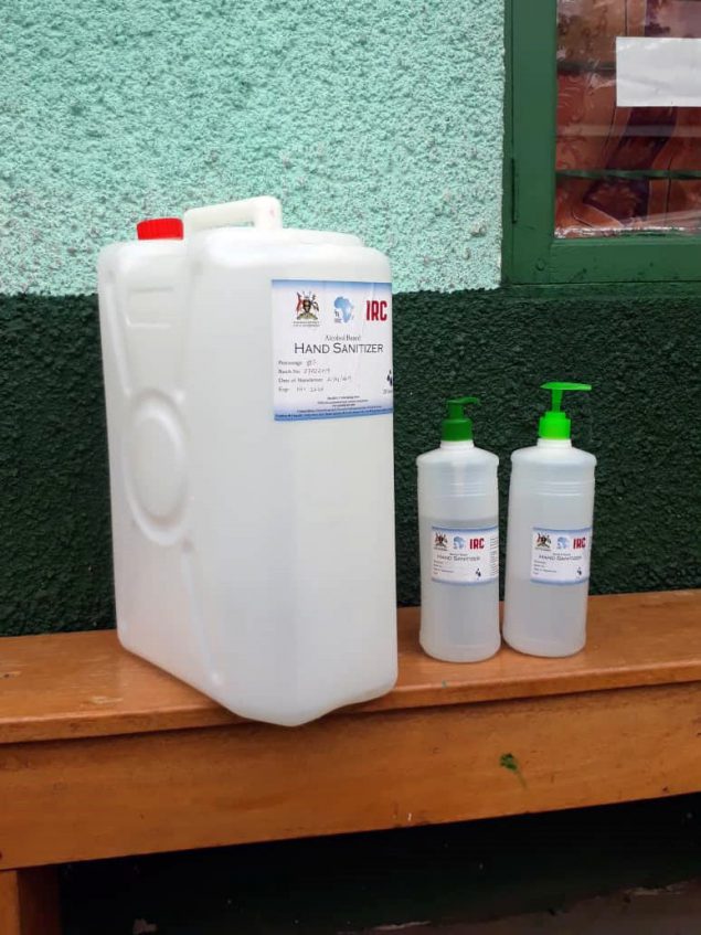 A large container and two smaller containers of alcohol-based hand rub