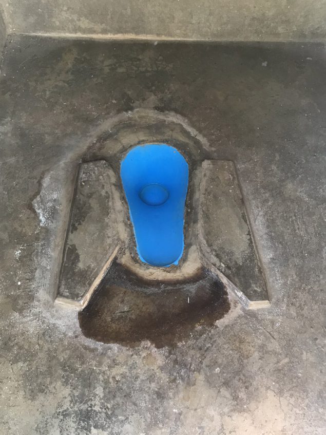 Fiberglass insert built into a latrine drophole.