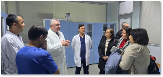 A group of doctors and visitors have a discussion inside a hematology-oncology clinic in Uzbekistan.