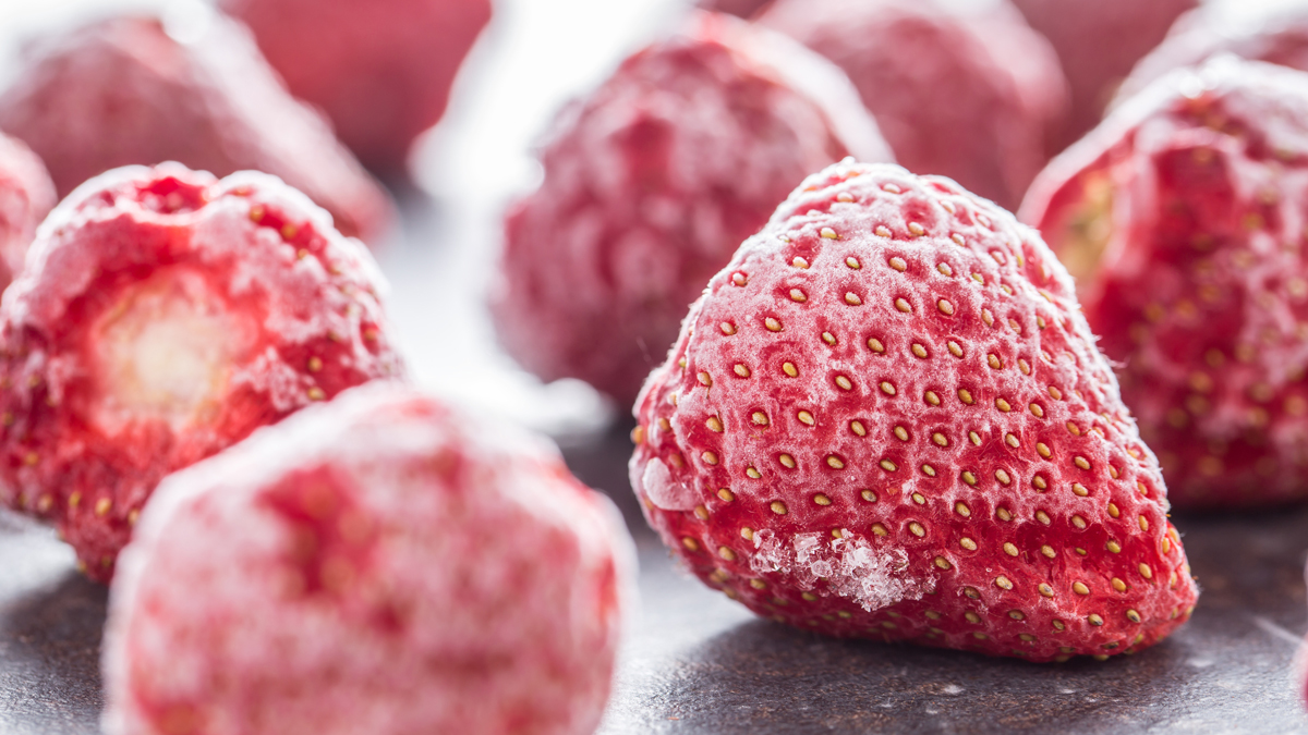 A close-up of organic strawberries that have been frozen.