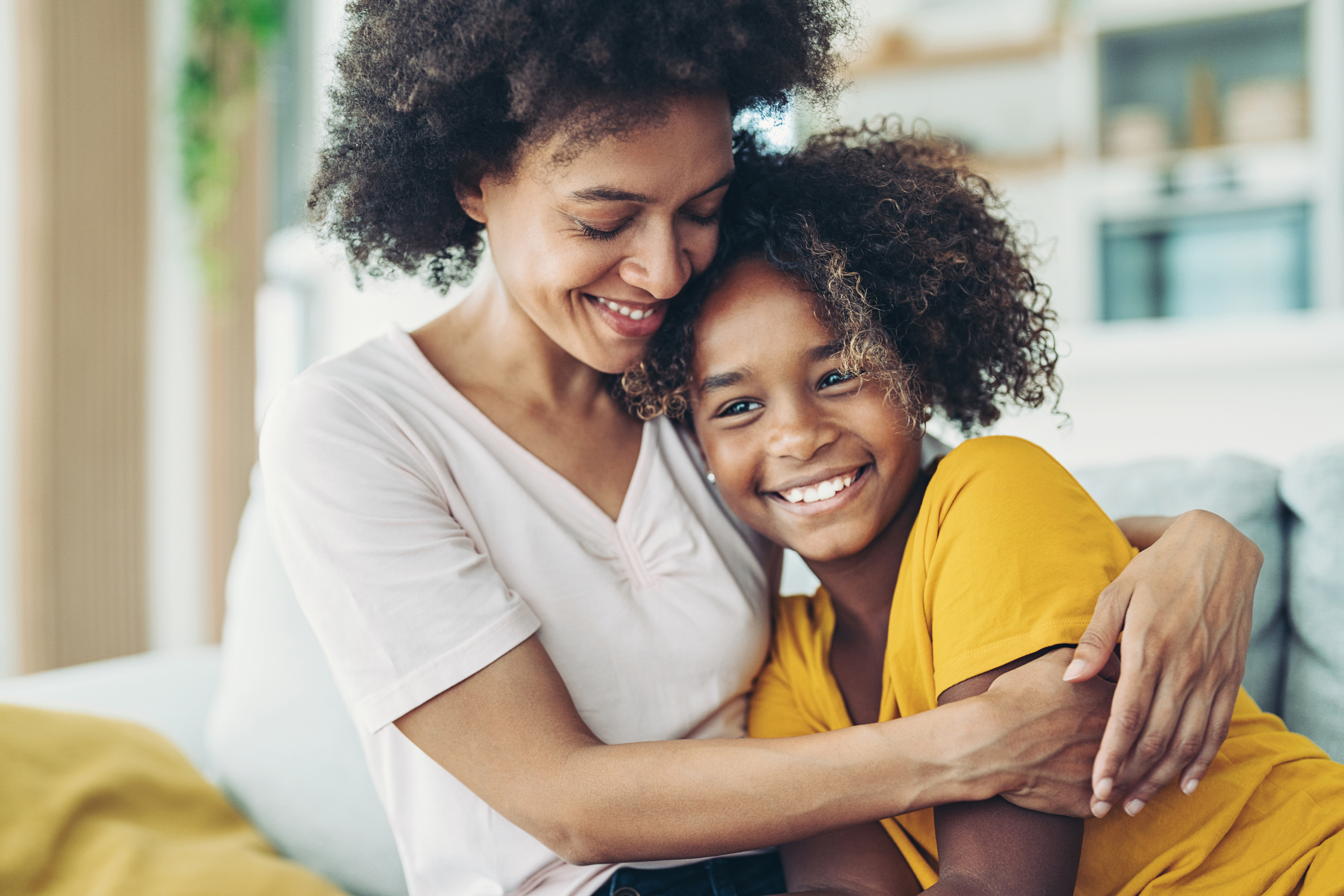 Loving mother Smiling mother embracing her daughter