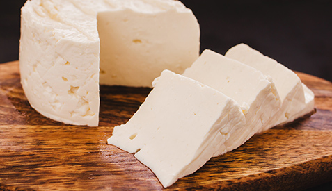 Photo of soft cheese on a cutting board