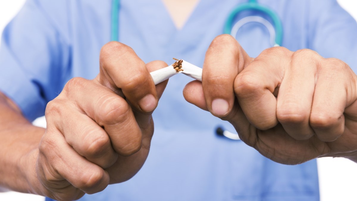 a doctor breaking a cigarette