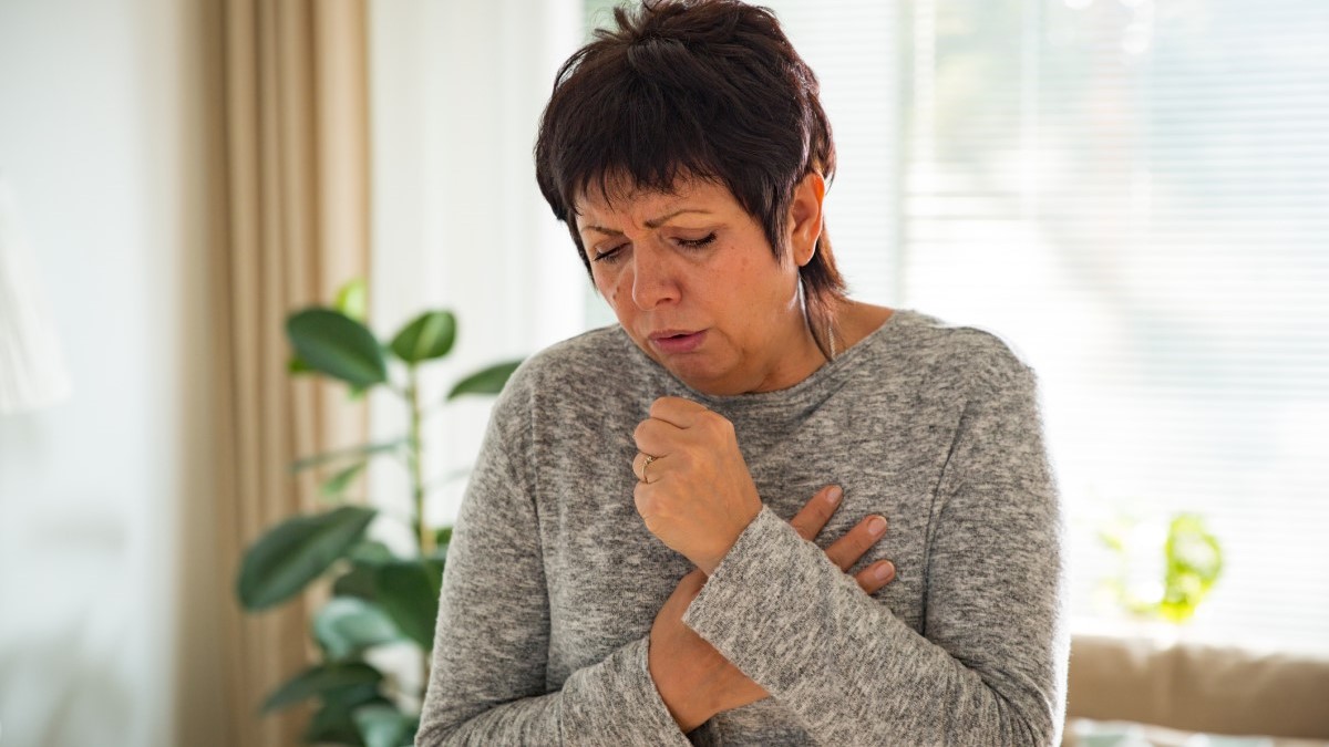 a woman coughing