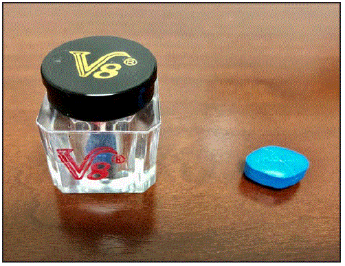 The figure is a photo showing a jar of &ldquo;V8,&rdquo; a male enhancement supplement purchased from a convenience store in Virginia in 2019 and one of the blue tablets from the jar.