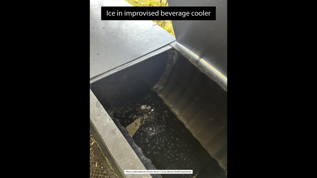 The image shows ice in an improvised beverage cooler.