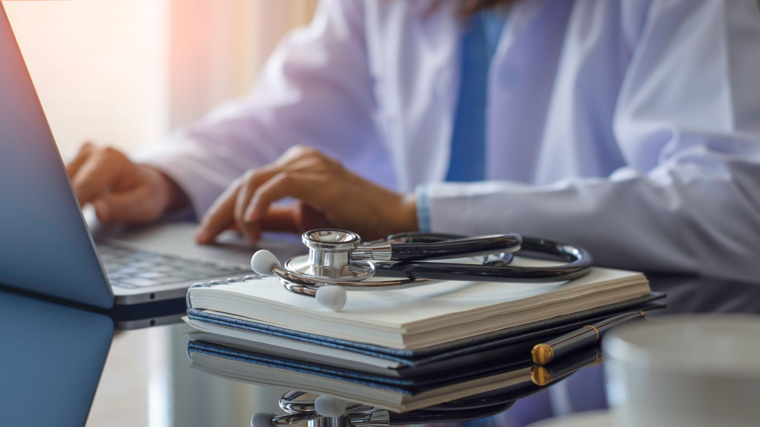 male doctor on a laptop