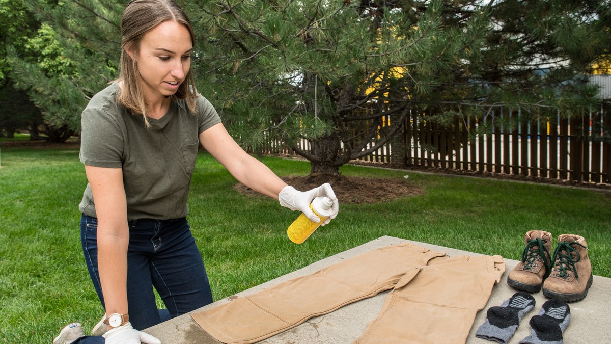 Permethrin treatment clothes Person treating clothing and gear with permethrin