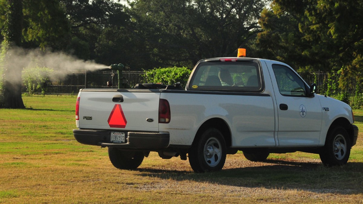 Truck mounted sprayer Buffalo applying pesticide to control mosquitoes.