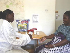pregnant-woman Pregnant woman in exam room