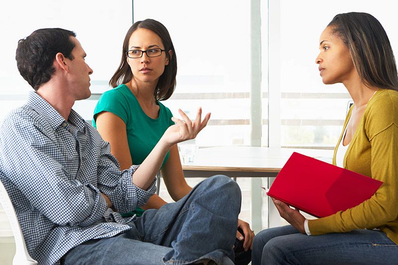 A childcare providor talks to families.