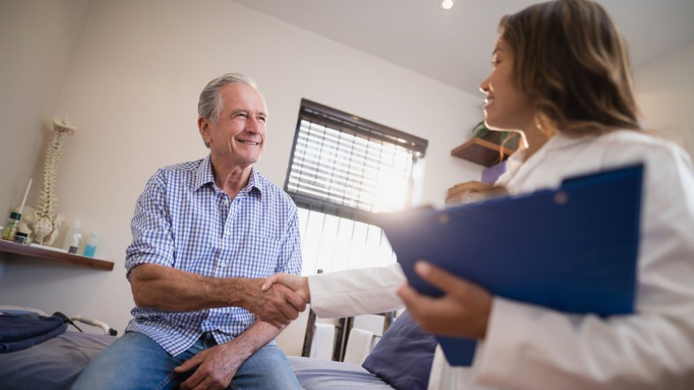 H&E Benefits landing page Doctor with patient