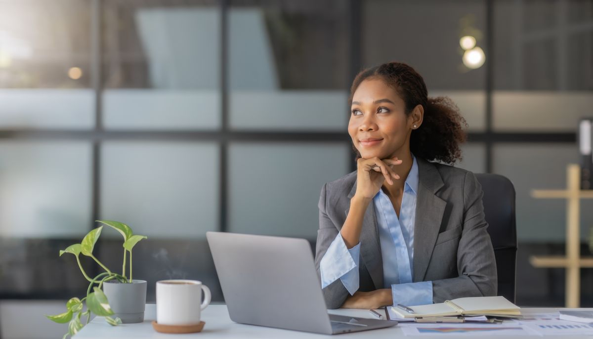 Young professional African-American woman looking outward from her office.