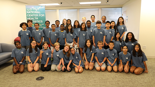 Group of students at UMD holding their certificates of participation of 2024 Data Detectives Camp.