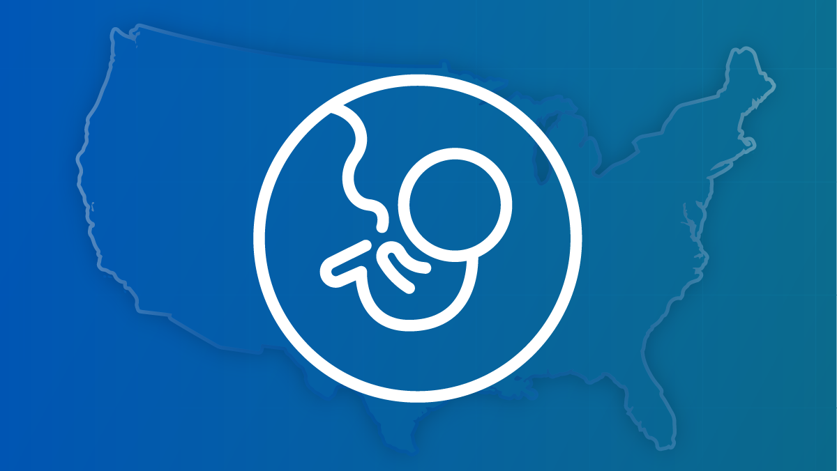 An outline of a baby in utero against a backdrop of a U.S. map.