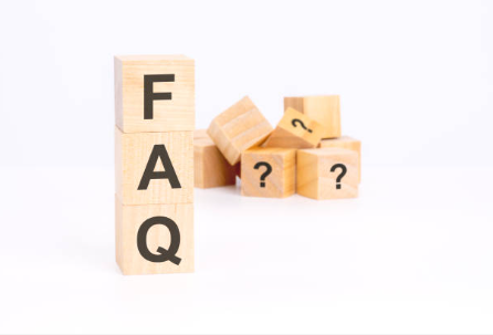 Decorative: wooden blocks labeled with "FAQ"