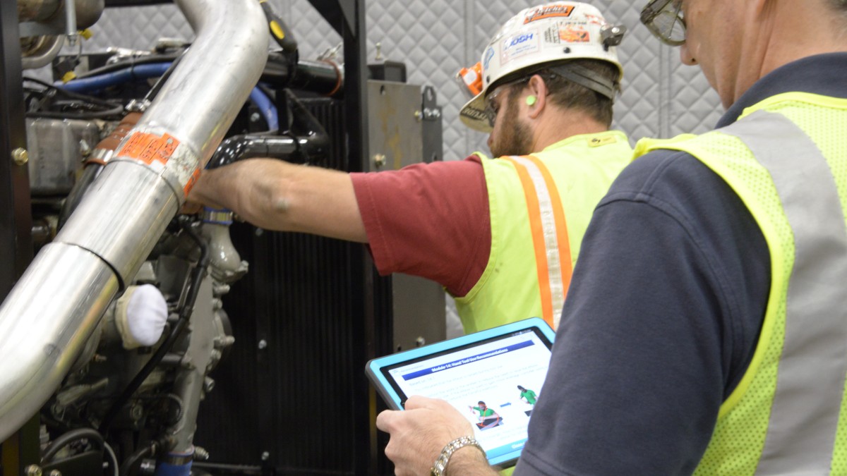 Supervisor observing a worker while using an audit tool
