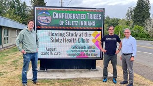 Confederated Tribes of Siletz Indian members and retired NIOSH researcher outside the Siletz Hearing Clinic.