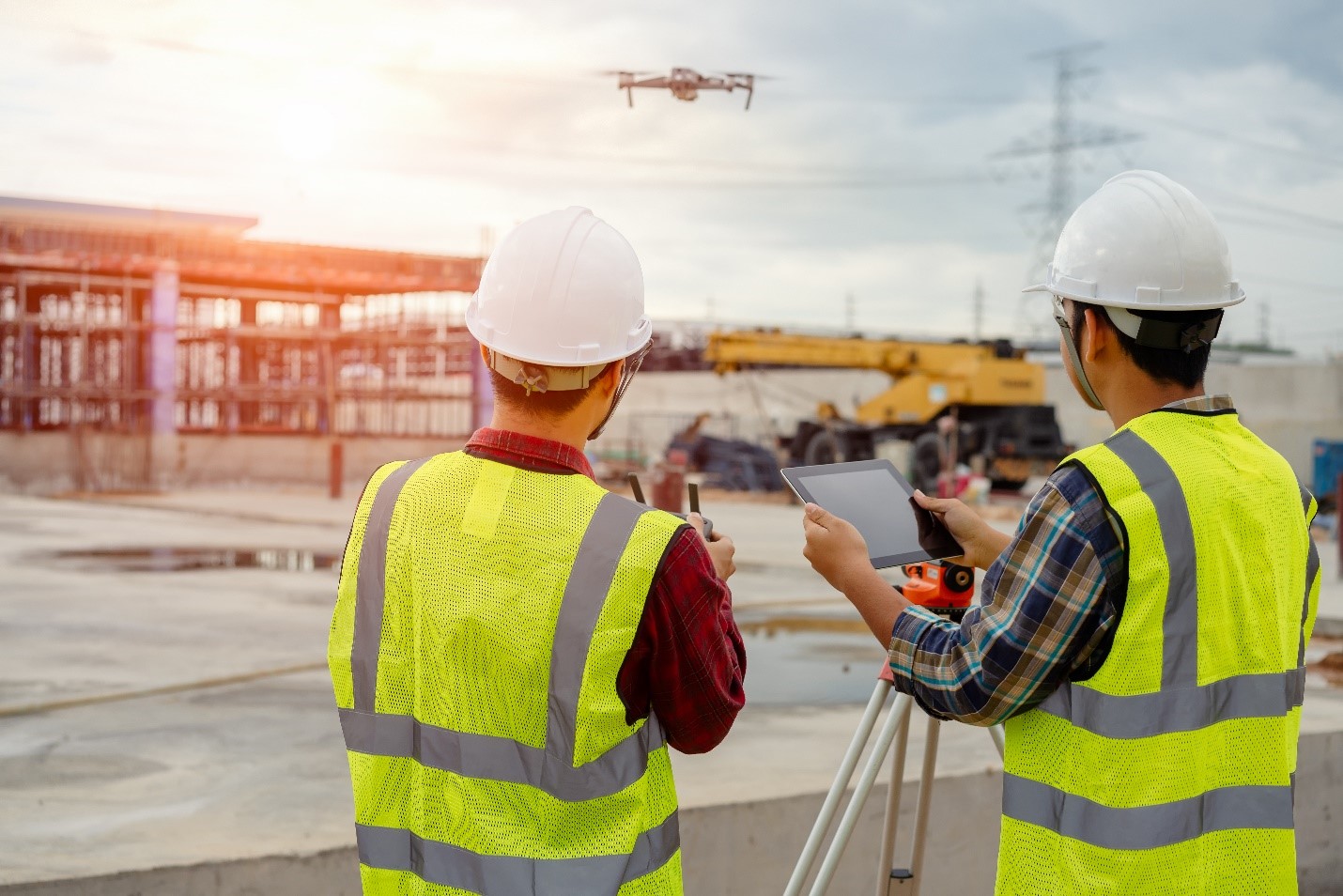 construction workers with drone.