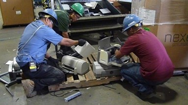 During the site visit, HHE team members observed employees manually disassembling printers.