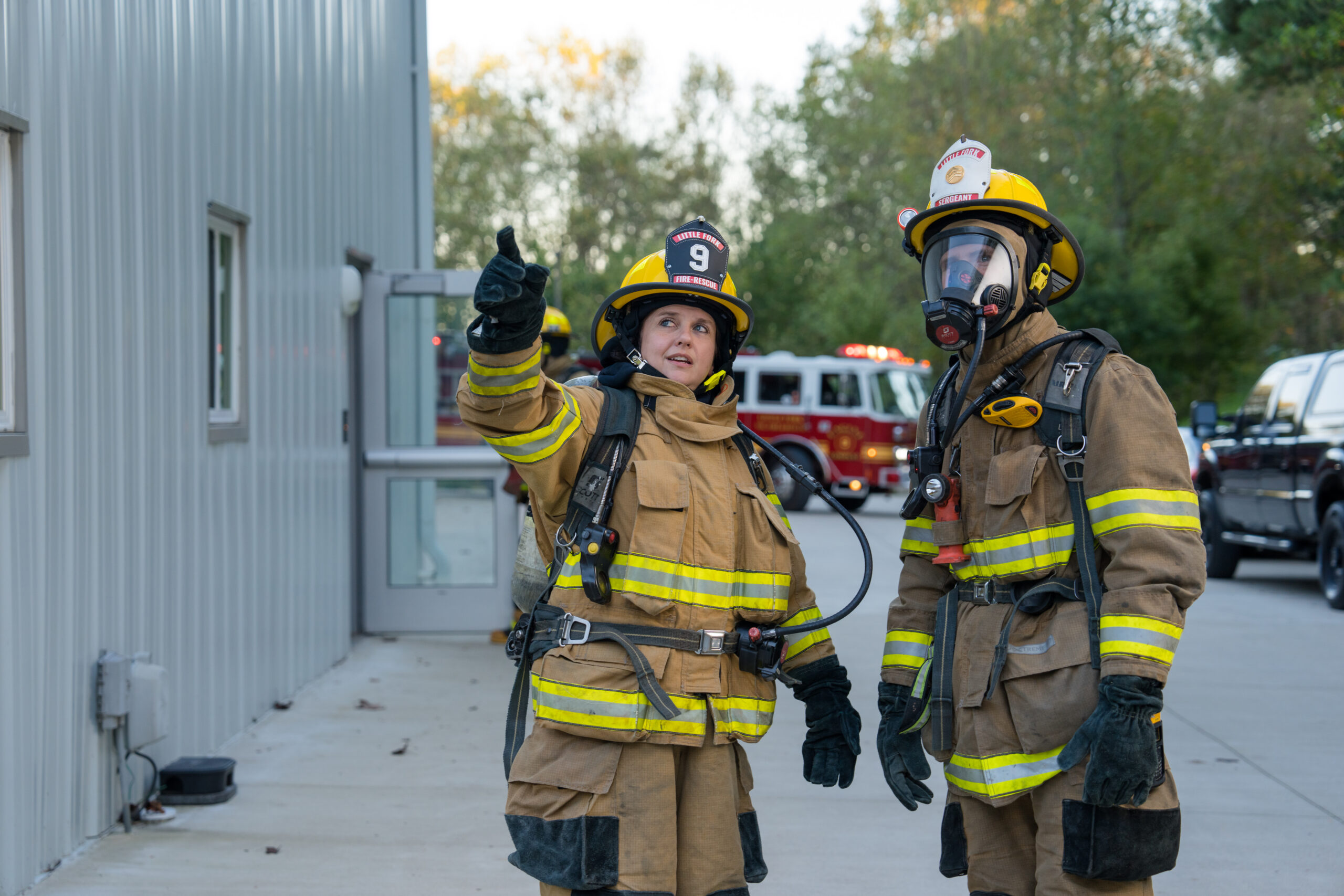 Image of two firefighters in gear.